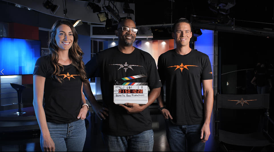Tavares Beverly on set with a clapboard during filming