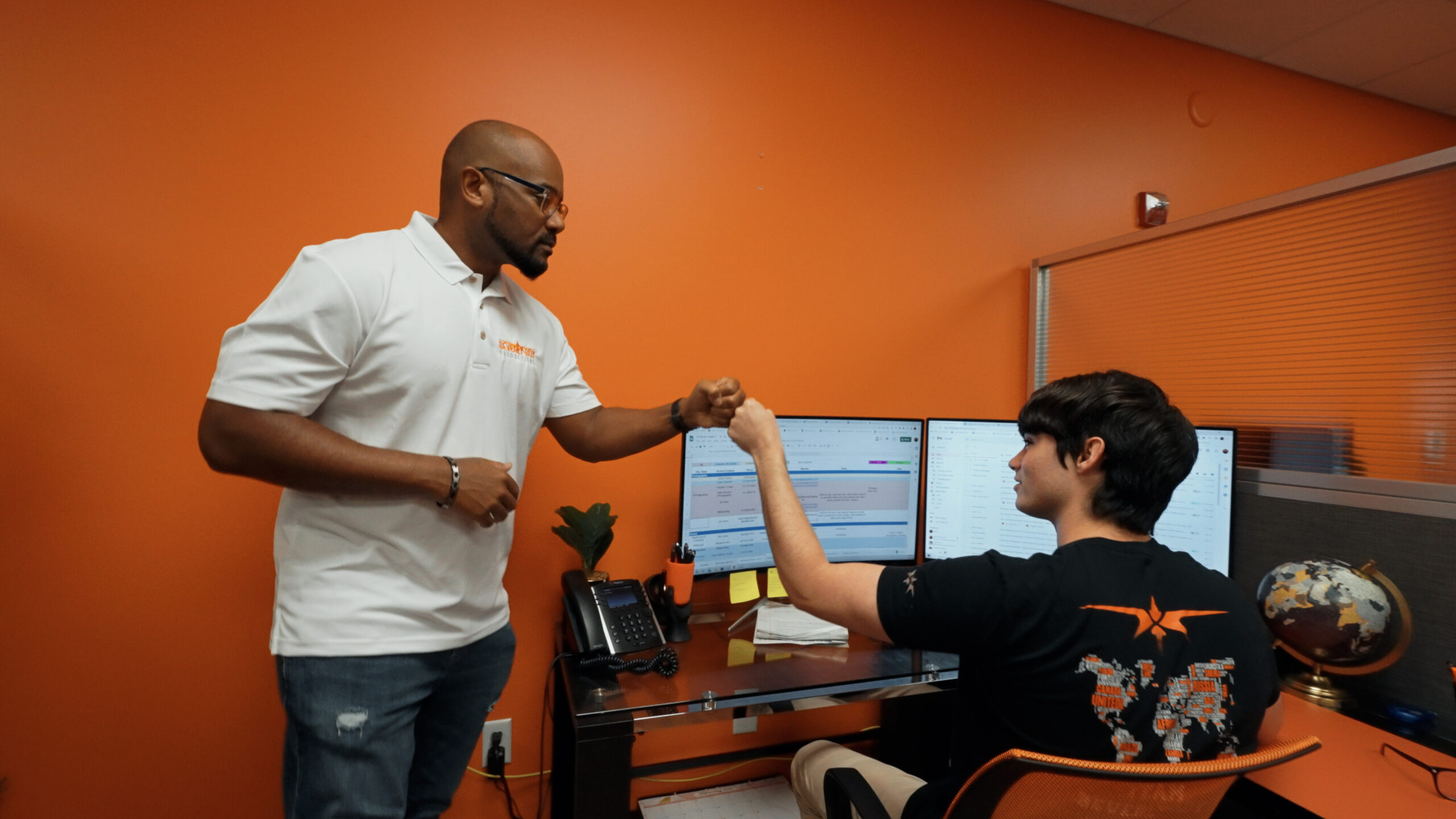 Tavares Beverly fist bumping his production coordinator on set